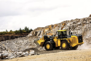 The production-class machine helps operators maintain stockpiles and heap hoppers through its bucket width of 12 feet and breakout force of 103,388 pounds