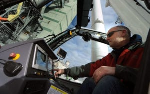 Crane Operator John Feiden demonstrates the controls of the new Tadano 450-ton crane recently purchased by Rozell Industries. The crane is the largest of its kind in the region. 